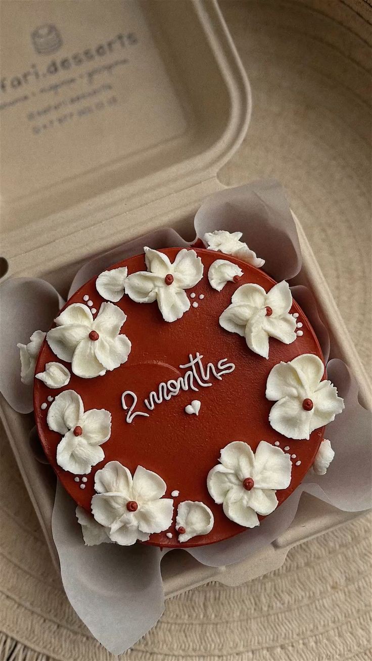 red floral Bento - red, dark, white theme with white piped flowers with red centers